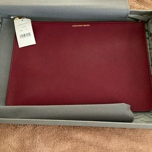 Red Alexander McQueen leather pocketbook mint condition, original packaging